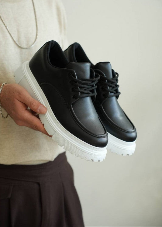 Men's Vantage Apex by Apollo Moda, black sneaker with bold white elevated sole, second angle